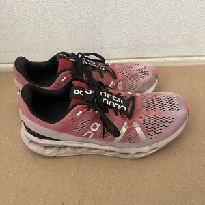 On Running Red and Black Athletic Shoes